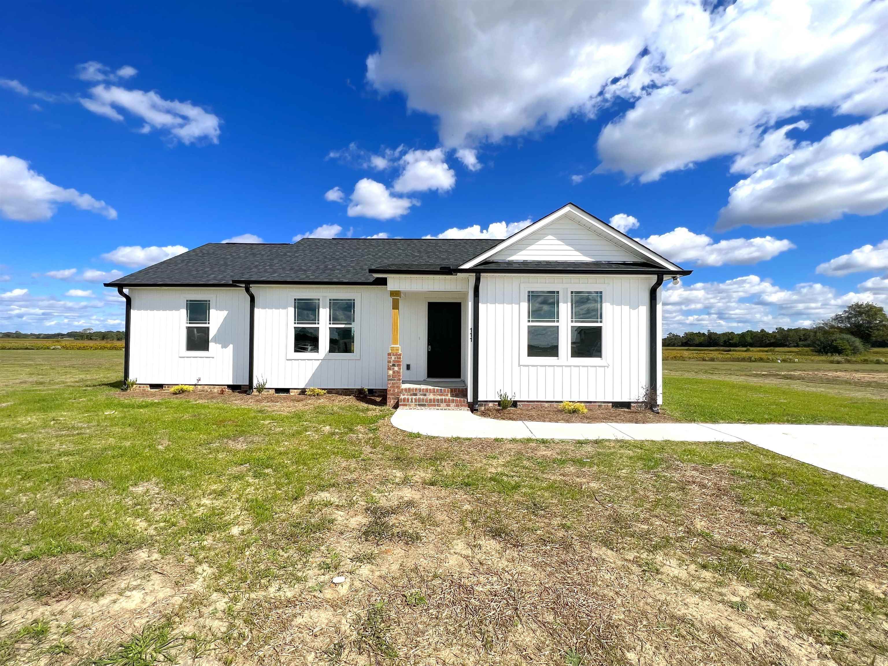111 Adds Road Pikeville, NC 27863 - Photo 2 of 23 a view of a house with a patio