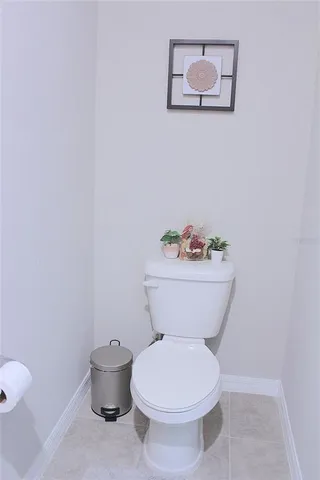 a white toilet sitting next to a bathroom sink