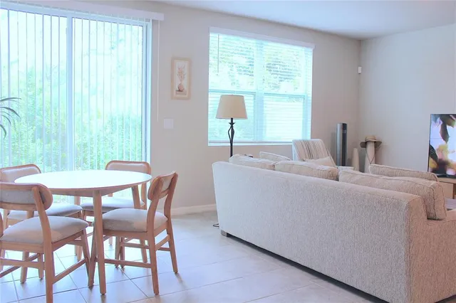 a living room with furniture and a window