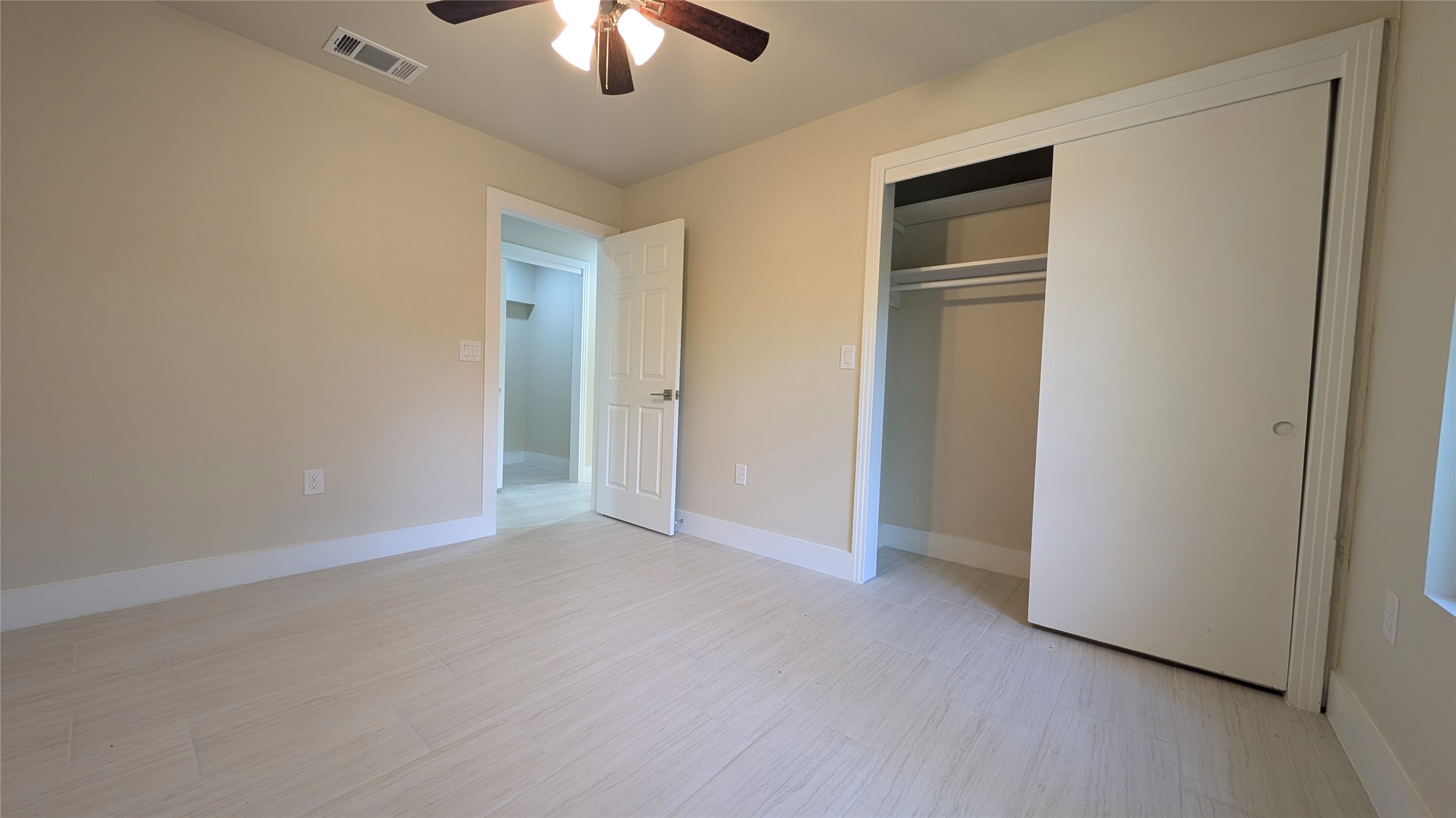 11811 Sleepy Hollow Road Manchaca, TX 78652 - Photo 22 of 31 an empty room with chandelier fan