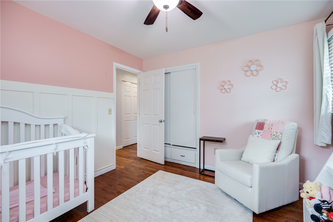 6950 Red Lion 5 Points Road Springboro, OH 45066 - Photo 35 of 78 This cozy bedroom features durable hardwood flooring and a ceiling fan for optimal comfort.