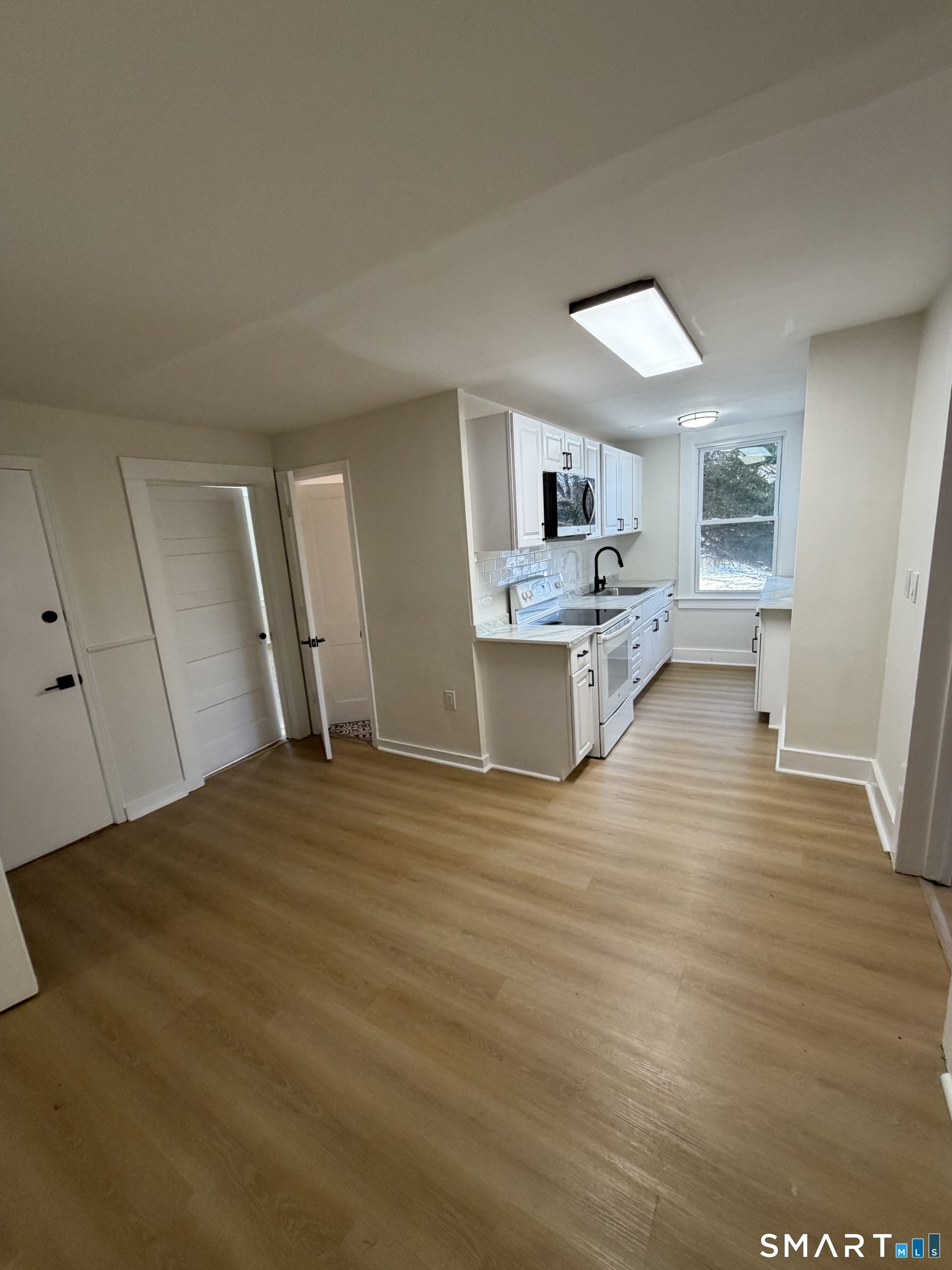 473 Amity Road Woodbridge, CT 06525 - Photo 2 of 16 a view of a kitchen and a sink