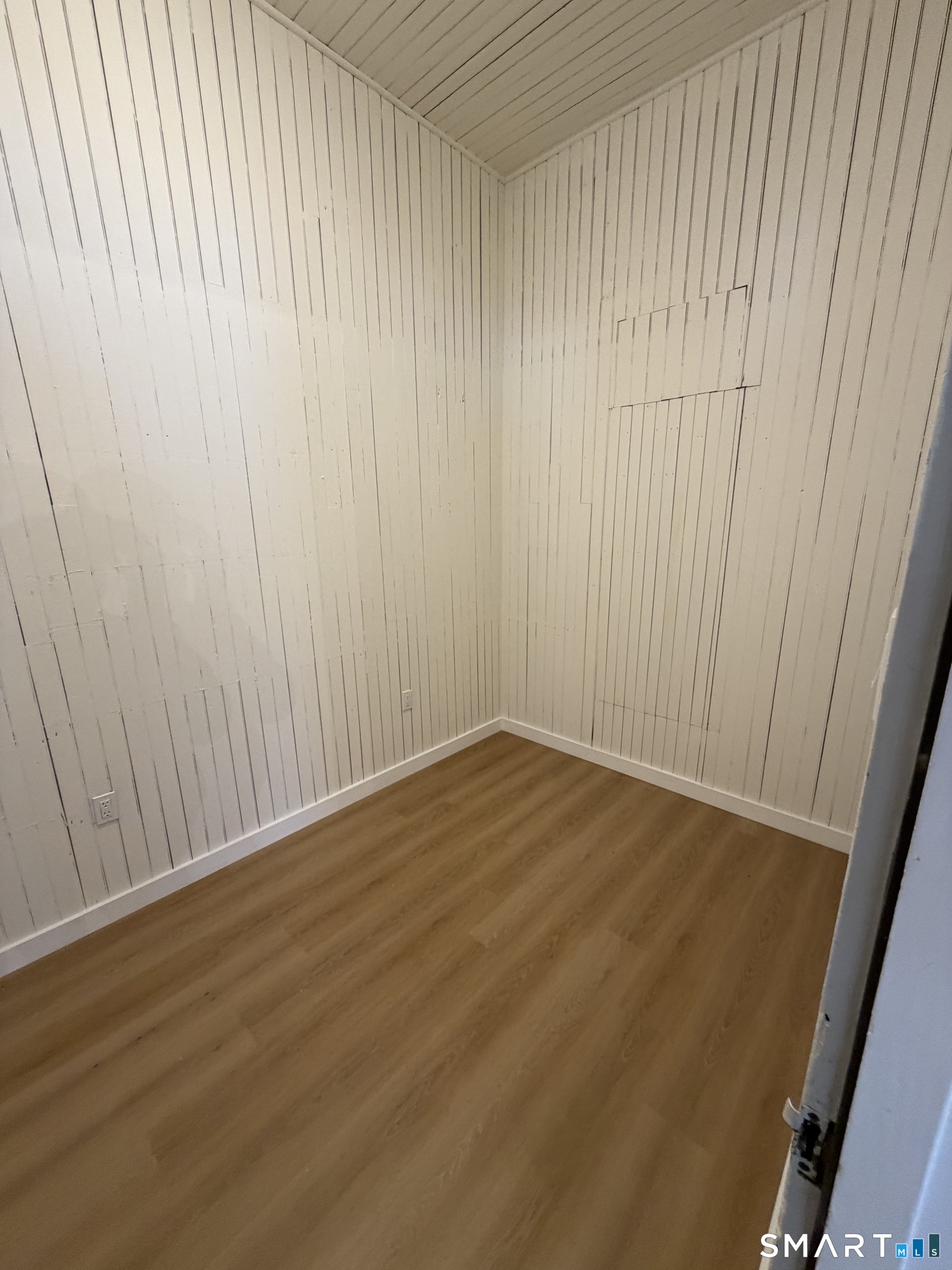 473 Amity Road Woodbridge, CT 06525 - Photo 5 of 16 a view of an empty room with wooden floor