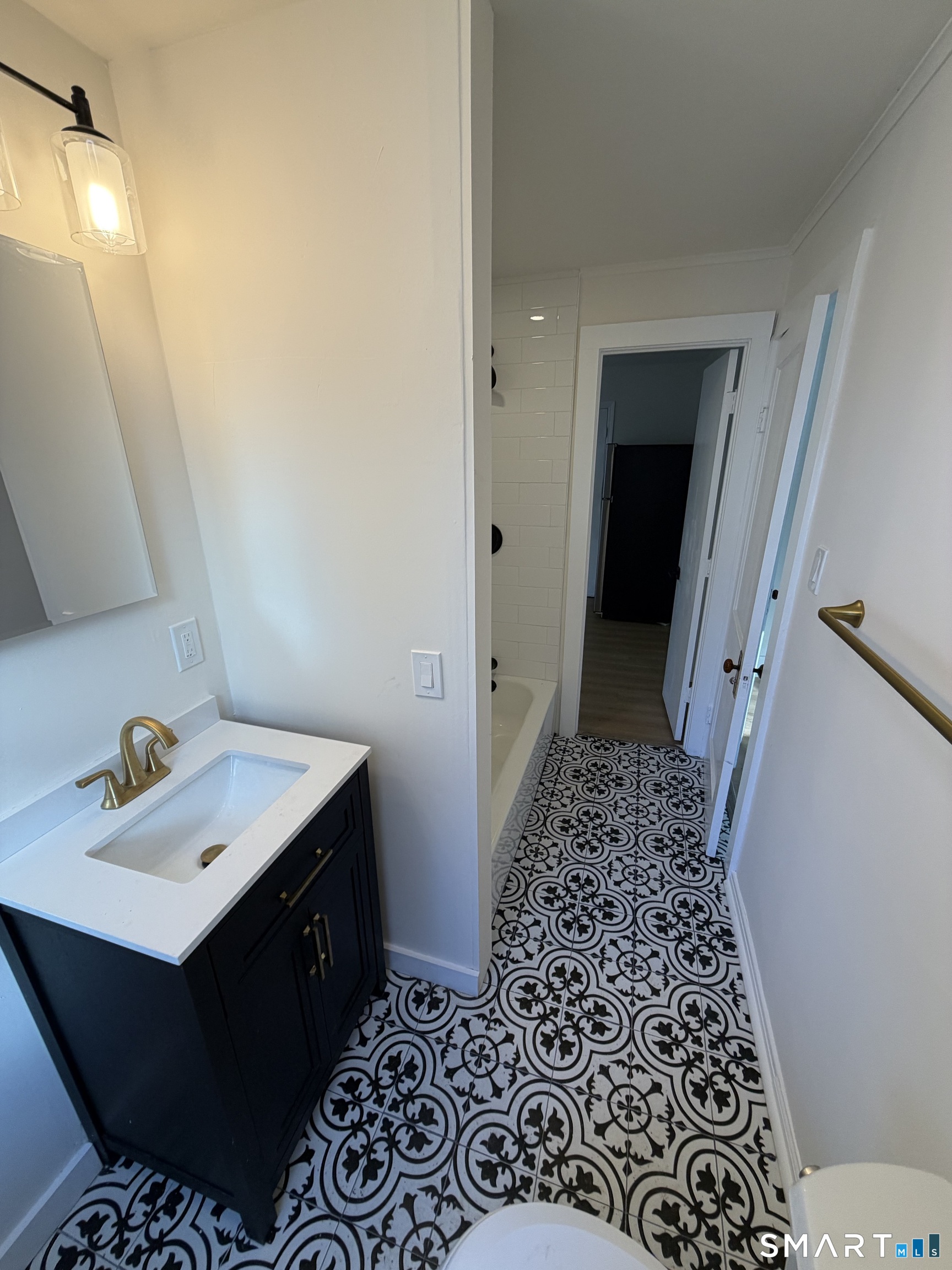 473 Amity Road Woodbridge, CT 06525 - Photo 9 of 16 a bathroom with a sink and a mirror