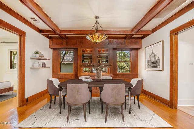 a view of a dining room with furniture window and wooden floor