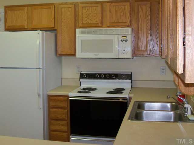 2124 Balboa Road Raleigh, NC 27603 - Photo 4 of 24 Kitchen features raised panel oak cabintry