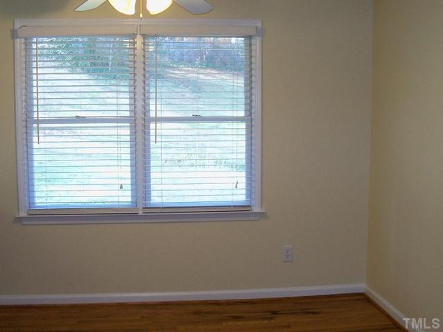 2124 Balboa Road Raleigh, NC 27603 - Photo 5 of 24 Dining area with hardwood floors overlooks large fenced back yard