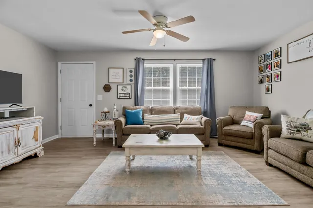 a living room with furniture and a window