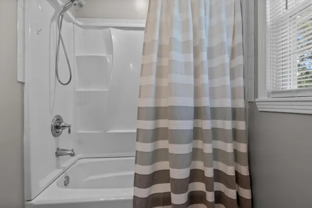 a bathroom with a shower curtain