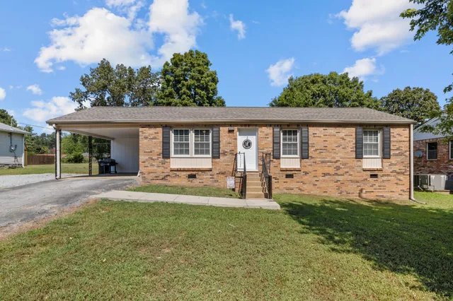 front view of a house with a yard