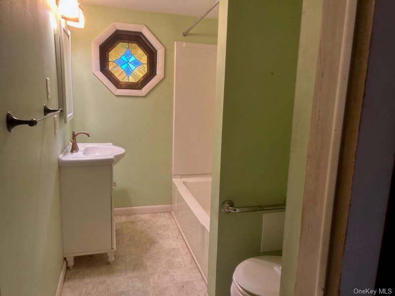 7 Highland Lake Road Eldred, NY 12732 - Photo 14 of 14 a bathroom with a sink and a mirror