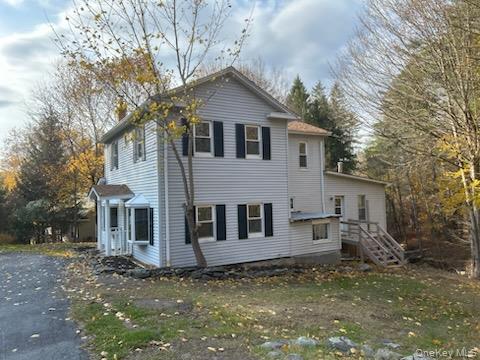 7 Highland Lake Road Eldred, NY 12732 - Photo 2 of 14 a view of a yard in front of a house with large tree