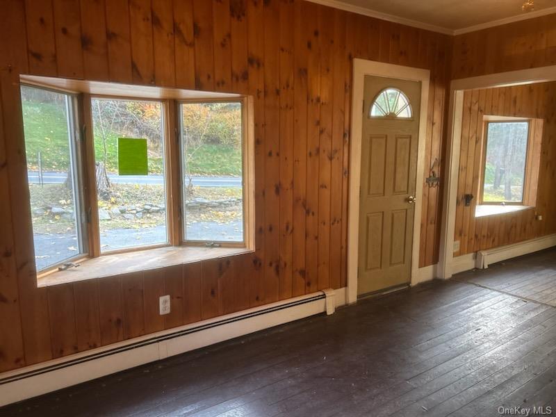 7 Highland Lake Road Eldred, NY 12732 - Photo 5 of 14 an empty room with wooden floor and windows