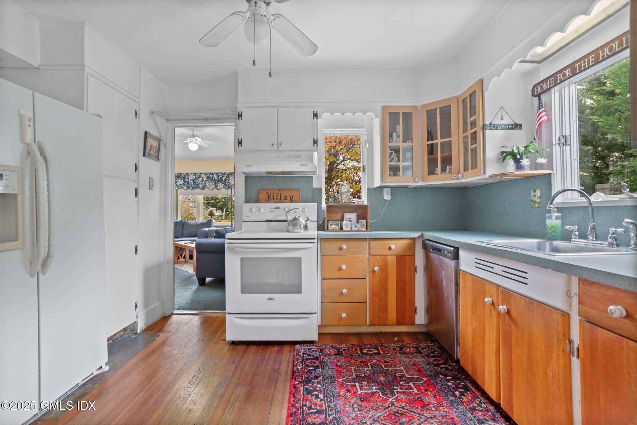 7 Highview Avenue Old Greenwich, CT 06870 - Photo 12 of 28 a kitchen with stainless steel appliances a stove a sink and a refrigerator