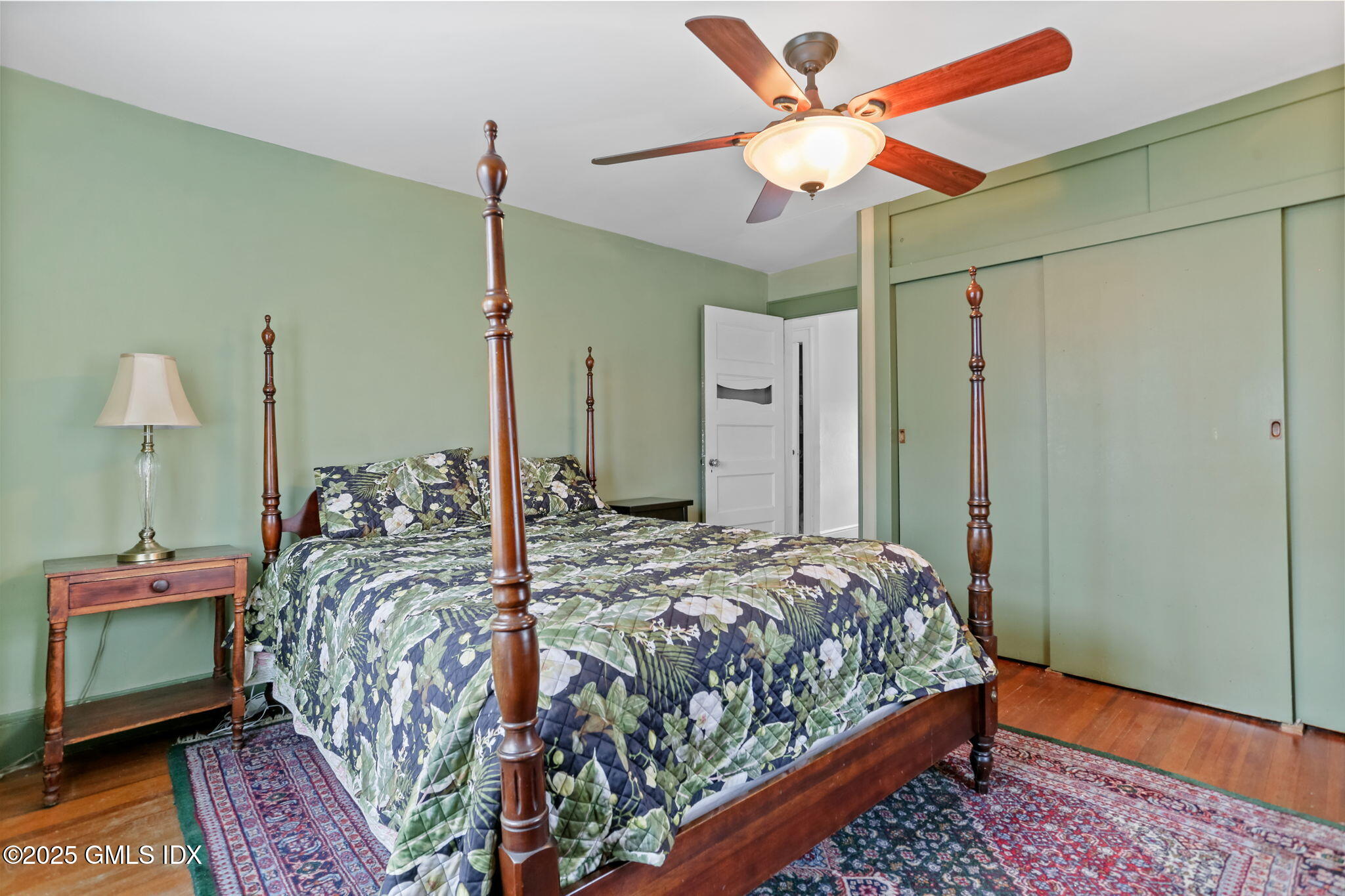 7 Highview Avenue Old Greenwich, CT 06870 - Photo 17 of 28 a bedroom with a bed chandelier and a window
