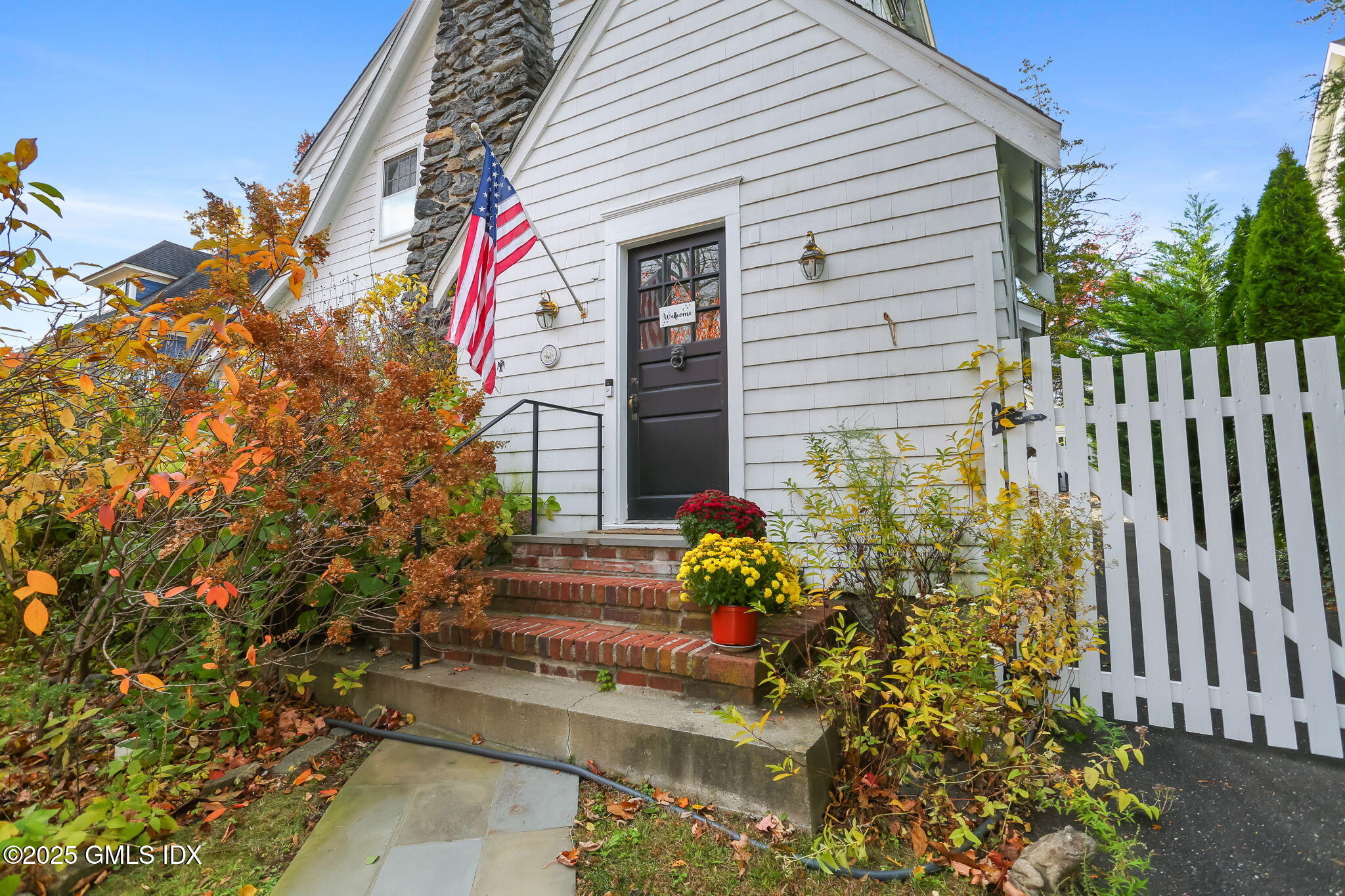 7 Highview Avenue Old Greenwich, CT 06870 - Photo 2 of 28 a front view of a house with a yard