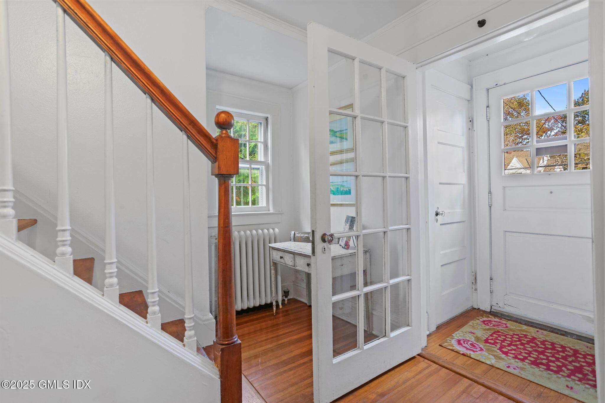 7 Highview Avenue Old Greenwich, CT 06870 - Photo 3 of 28 a view of an entryway with wooden floor and windows