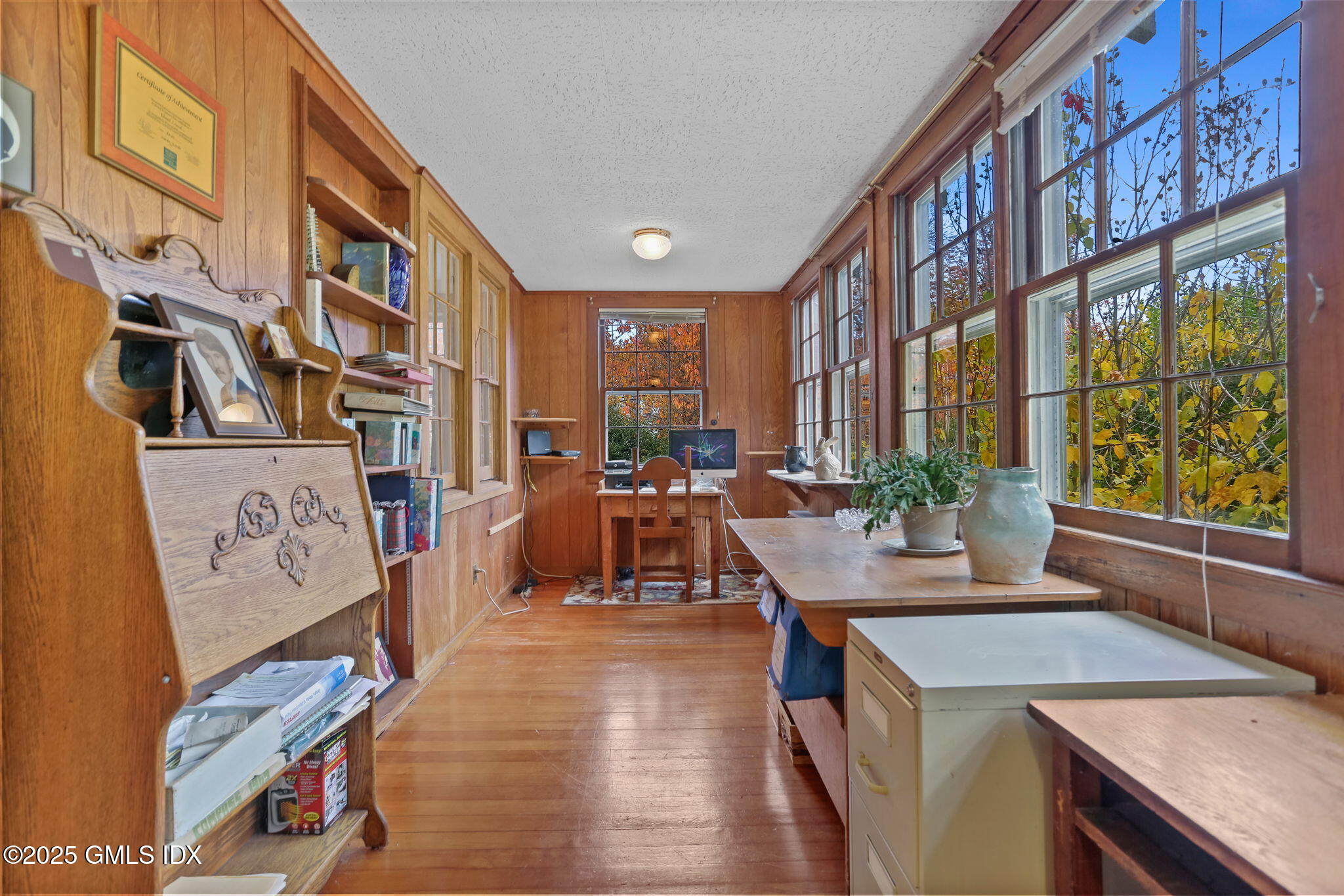 7 Highview Avenue Old Greenwich, CT 06870 - Photo 10 of 28 a view of a dining room with furniture and a floor to ceiling window