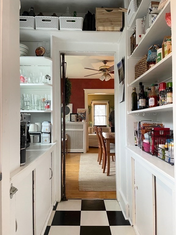 51 Presentation Road, Unit 1 Boston, MA 02135 - Photo 11 of 15 a kitchen with a refrigerator and cabinets