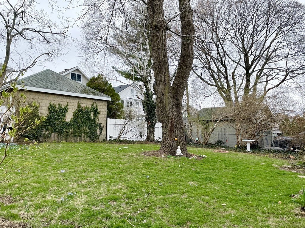 51 Presentation Road, Unit 1 Boston, MA 02135 - Photo 14 of 15 a view of a house with a yard