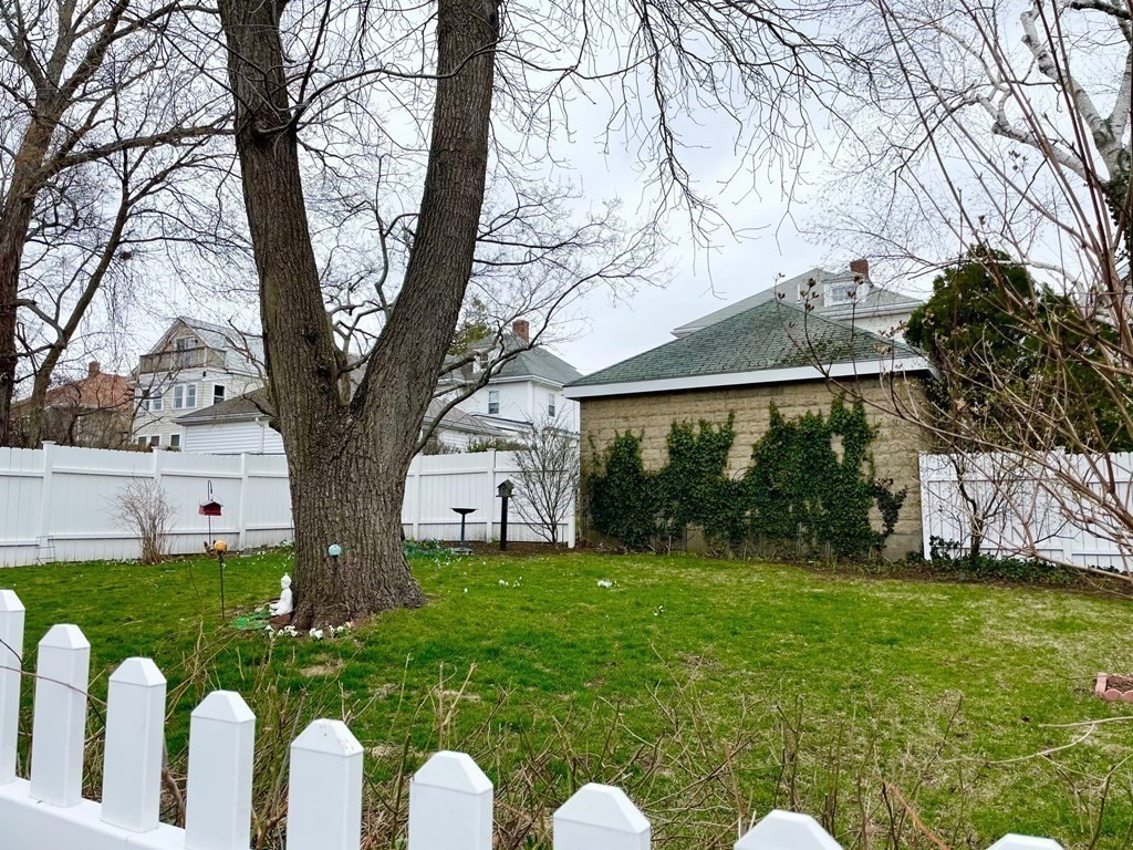 51 Presentation Road, Unit 1 Boston, MA 02135 - Photo 15 of 15 a view of a garden with large trees