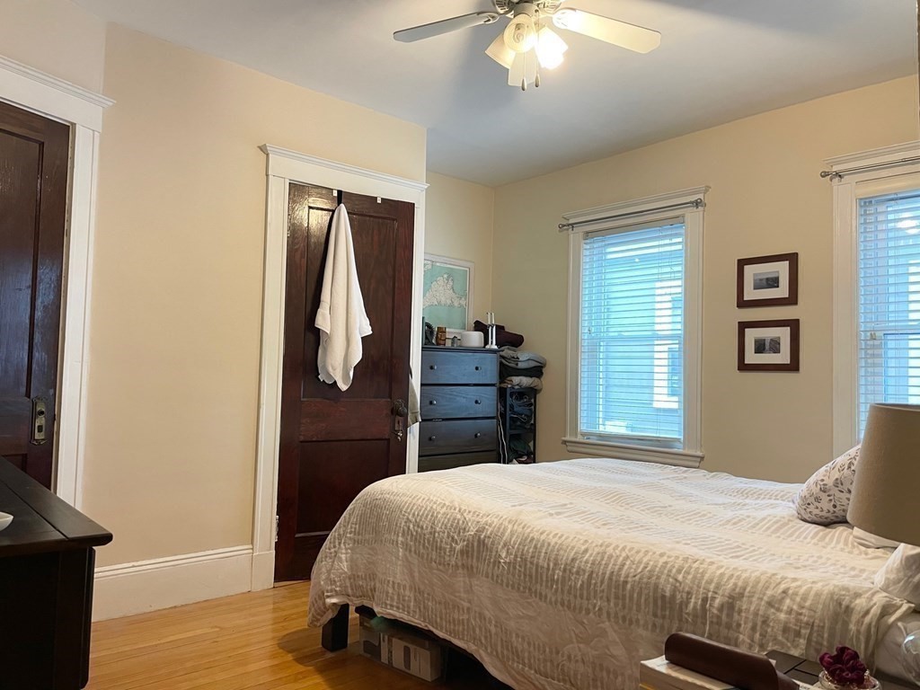 51 Presentation Road, Unit 1 Boston, MA 02135 - Photo 7 of 15 a bedroom with a bed and a window
