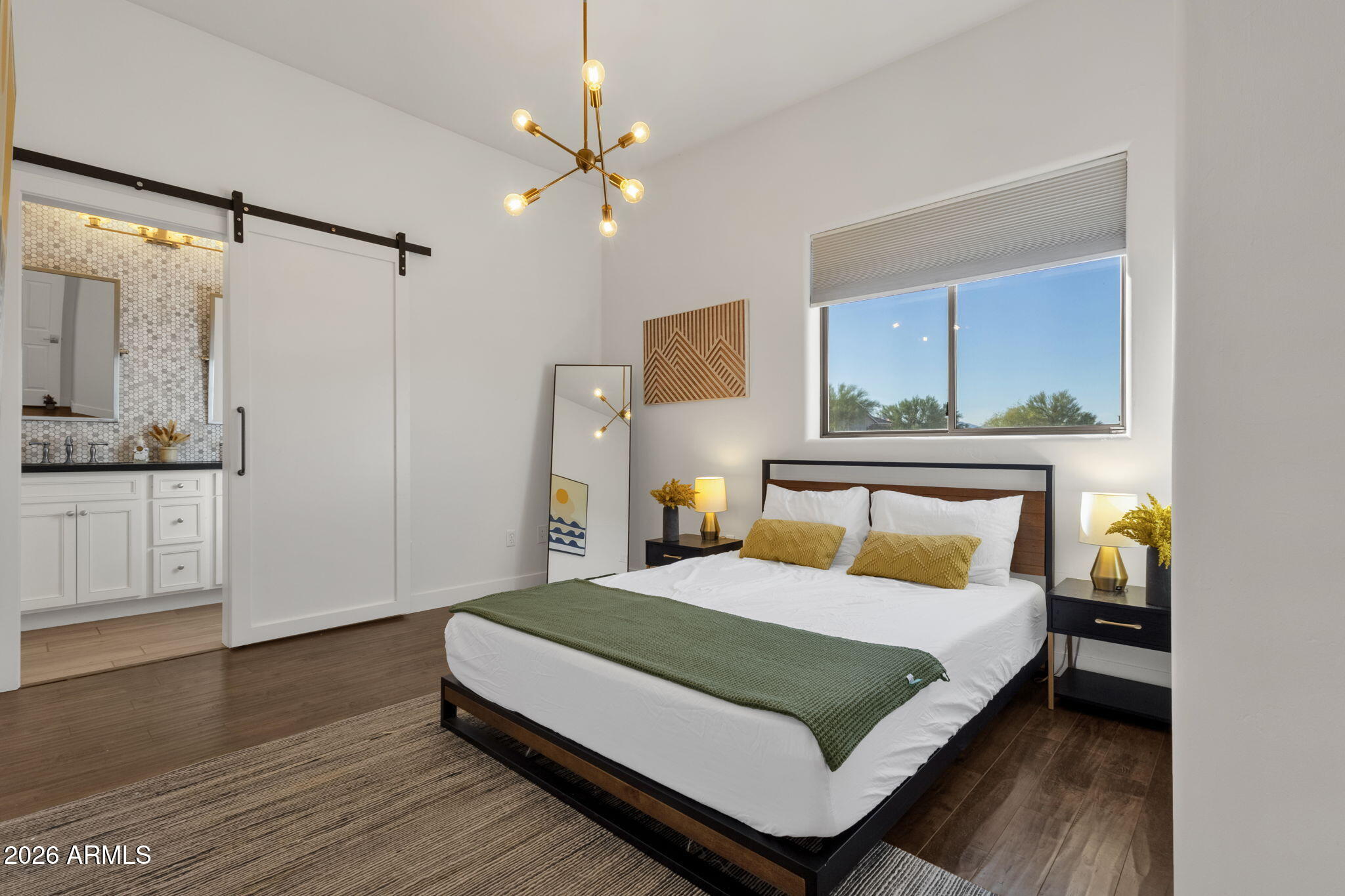 14604 East Peak View Road Scottsdale, AZ 85262 - Photo 19 of 55 a bedroom with a large bed and a chandelier