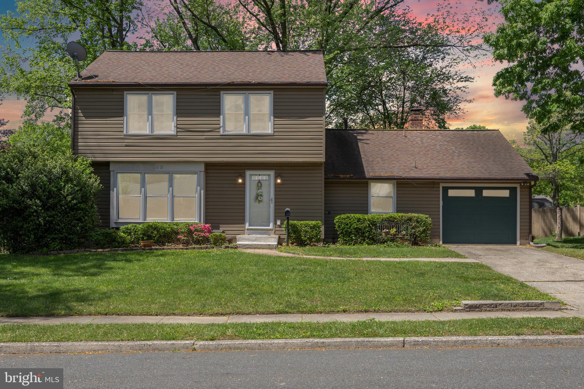 153 Oxford Road Delran, NJ 08075 - Photo 1 of 24 a front view of a house with a yard
