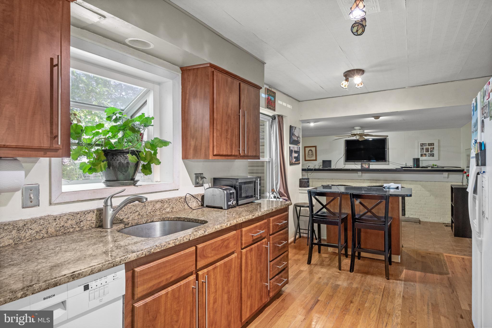 153 Oxford Road Delran, NJ 08075 - Photo 5 of 24 a kitchen with stainless steel appliances granite countertop sink stove top oven and cabinets