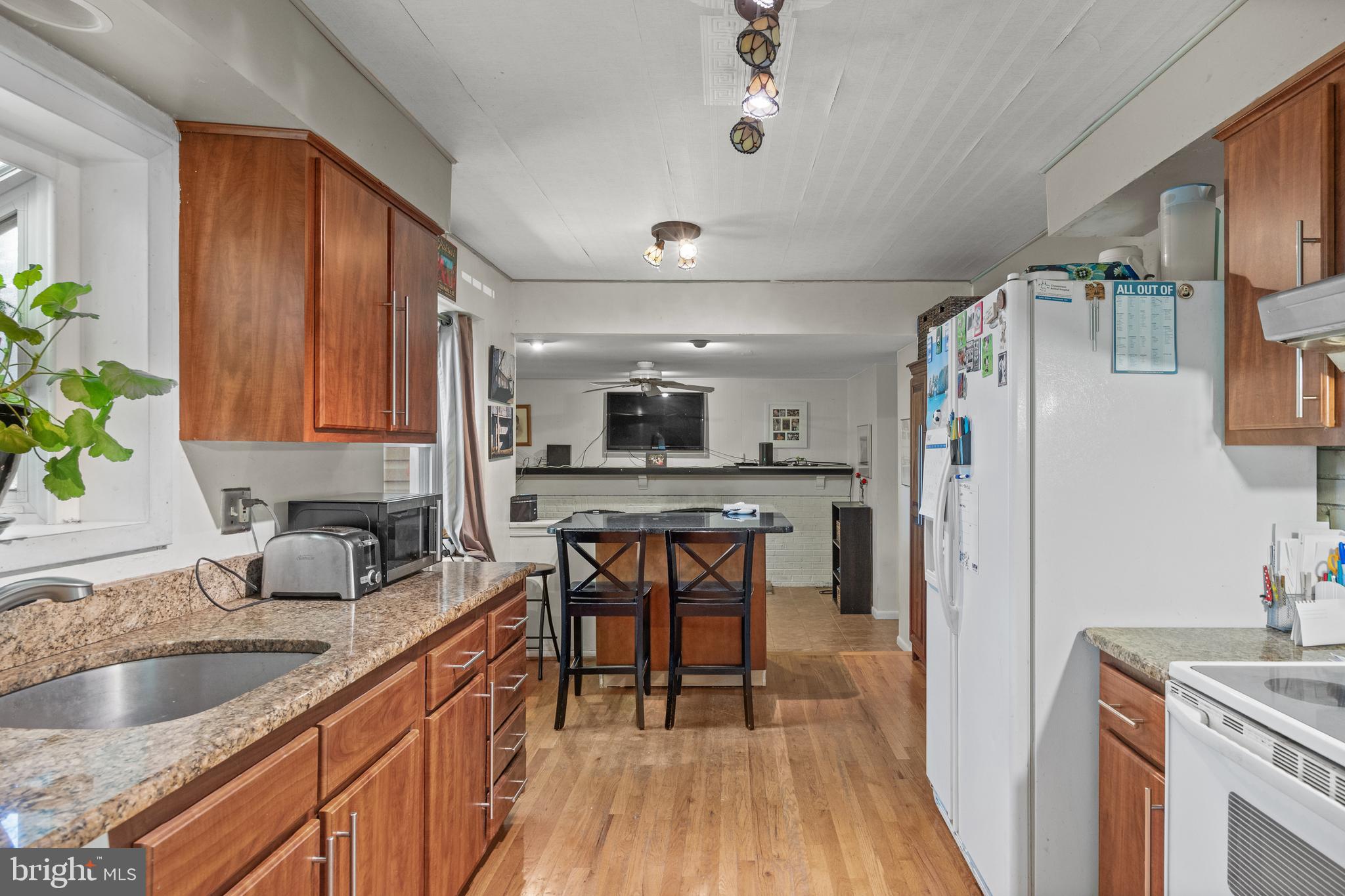 153 Oxford Road Delran, NJ 08075 - Photo 6 of 24 a kitchen with stainless steel appliances granite countertop a sink stove and refrigerator