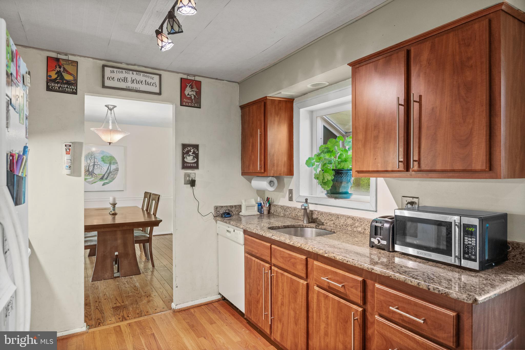153 Oxford Road Delran, NJ 08075 - Photo 7 of 24 a kitchen with stainless steel appliances granite countertop a sink stove and cabinets