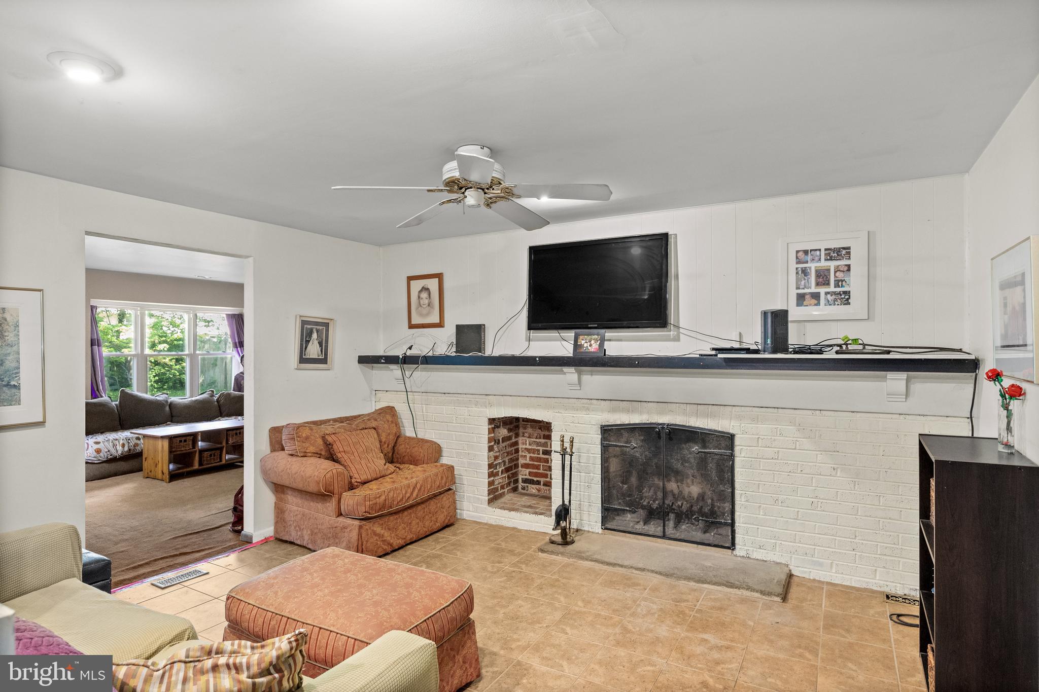 153 Oxford Road Delran, NJ 08075 - Photo 8 of 24 a living room with furniture and a flat screen tv