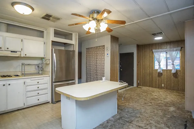 a bathroom with a sink a large mirror and a shower