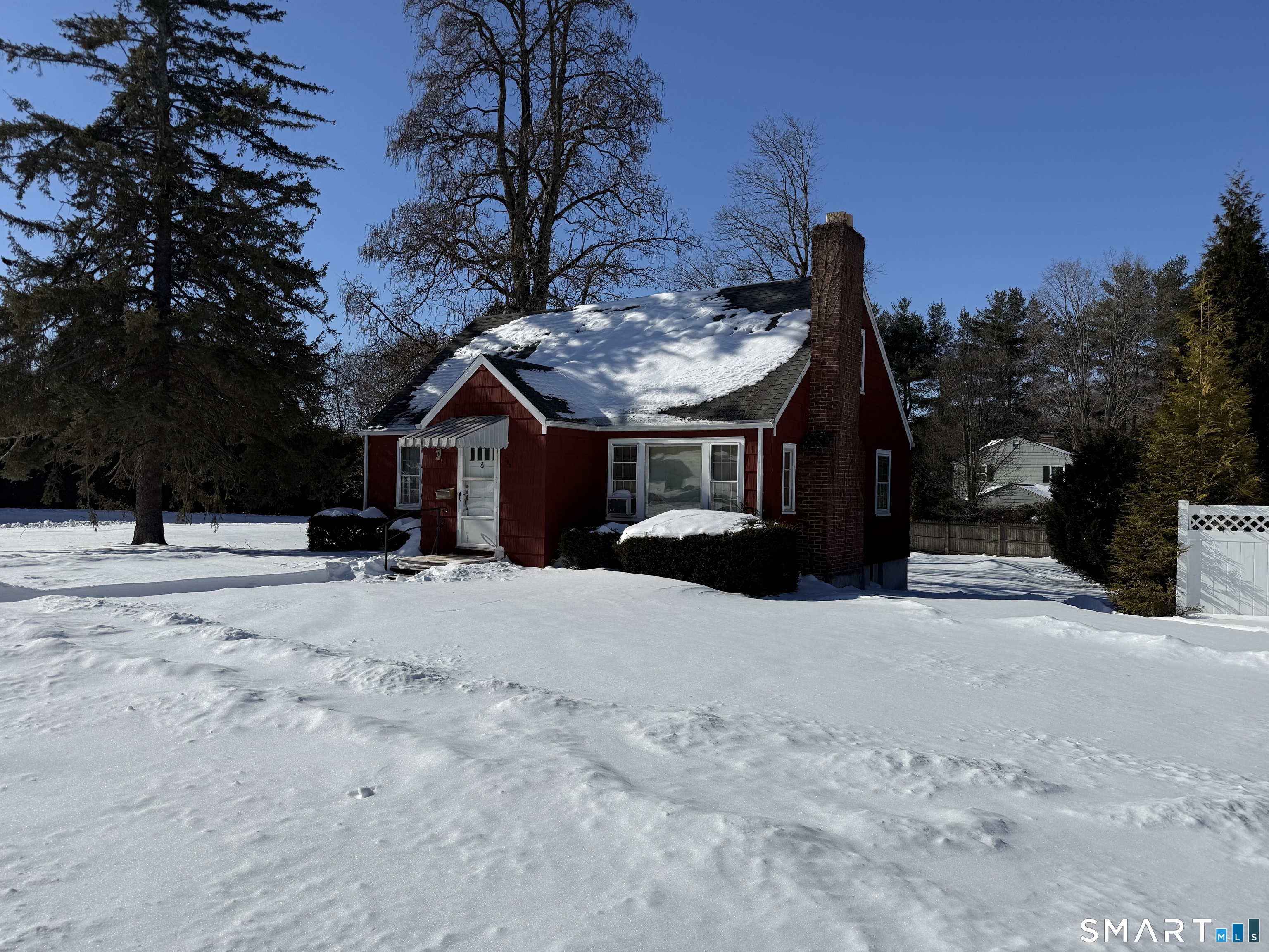 233 Church Street Newington, CT 06111 - Photo 1 of 18 a view of a house with snow on the road