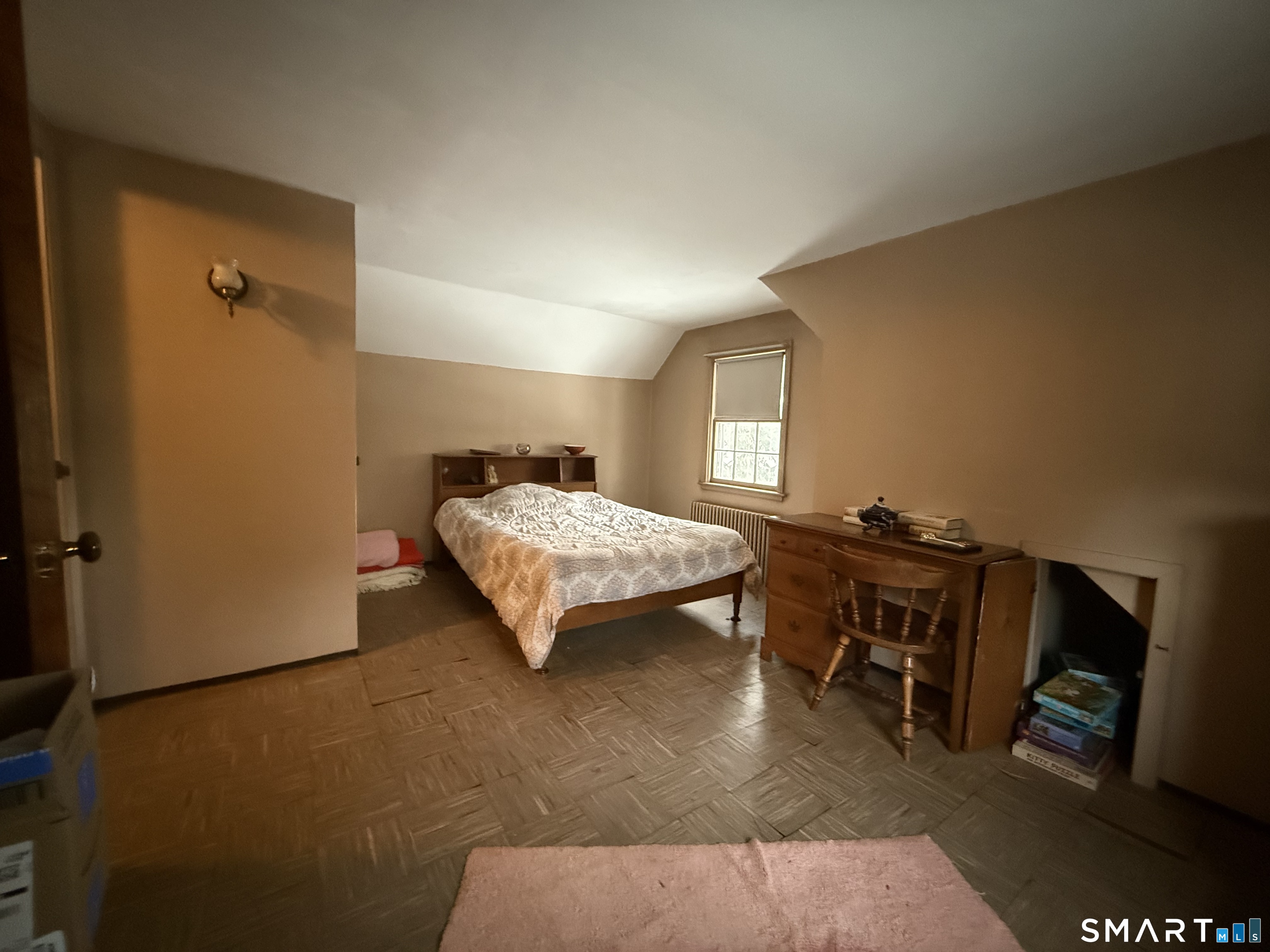 233 Church Street Newington, CT 06111 - Photo 11 of 18 a bedroom with a bed and wooden floor