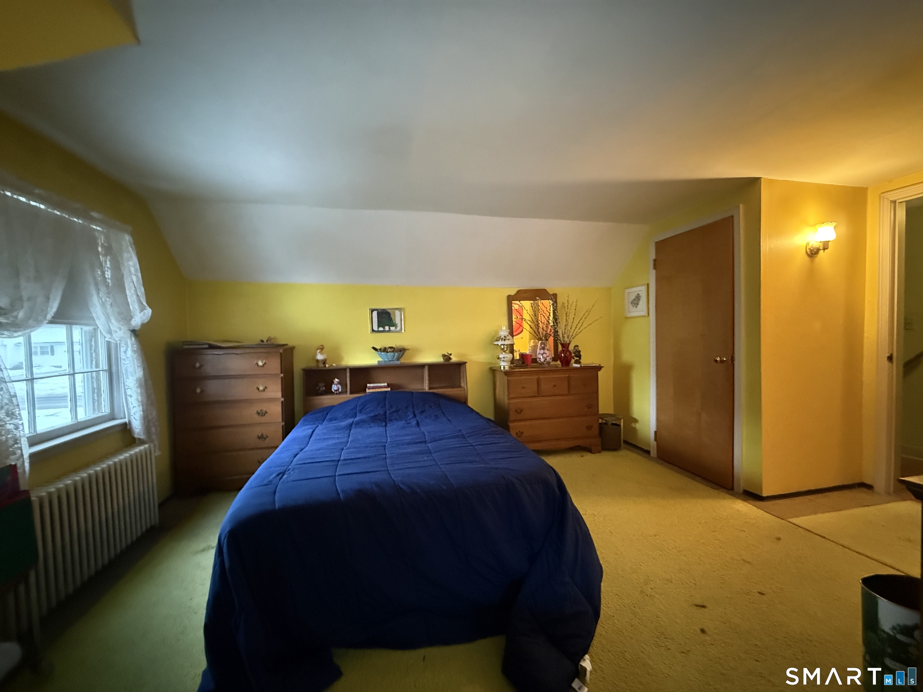 233 Church Street Newington, CT 06111 - Photo 15 of 18 a bedroom with a bed and cabinets
