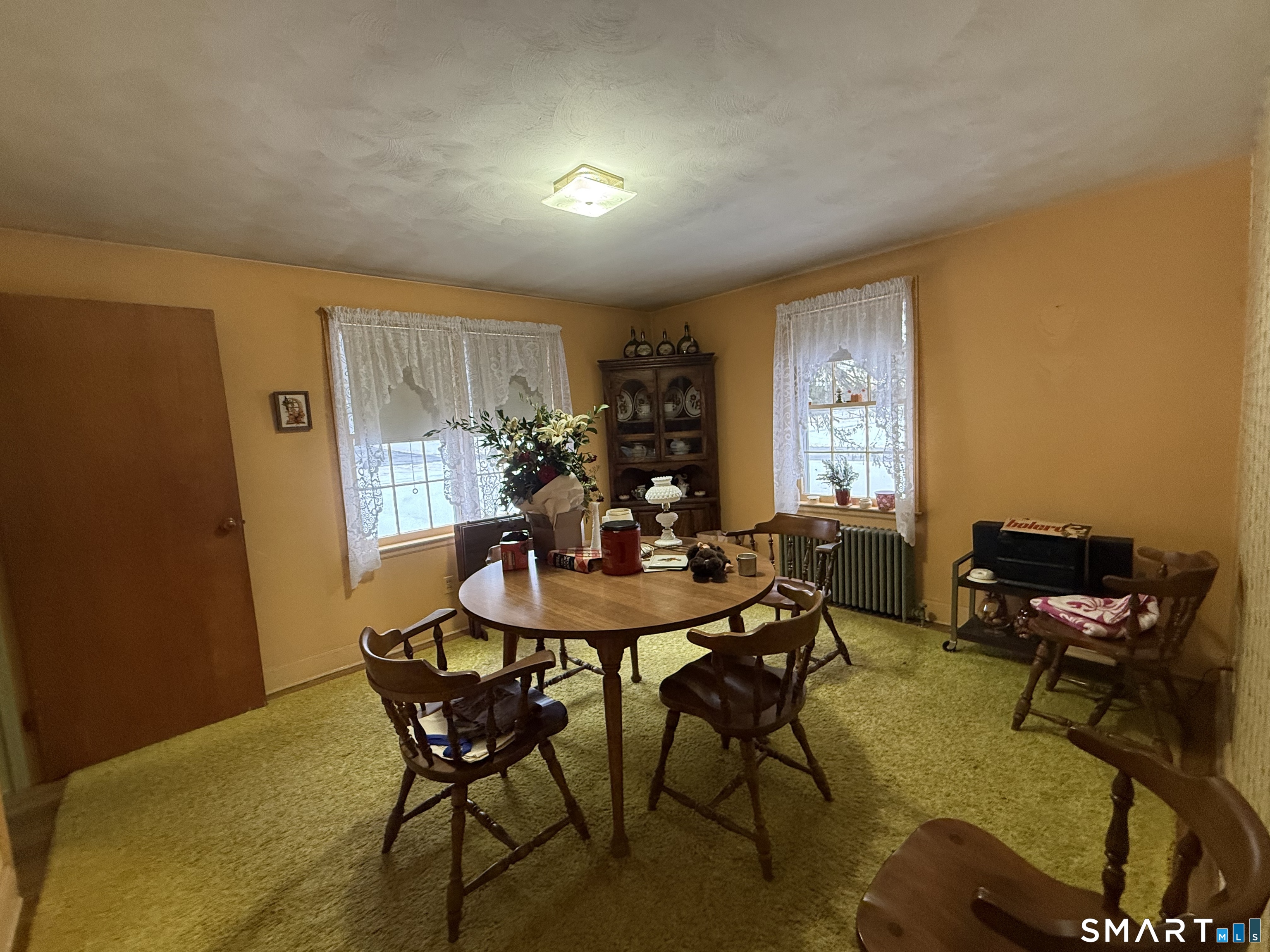 233 Church Street Newington, CT 06111 - Photo 6 of 18 a view of a dining room with furniture and a window