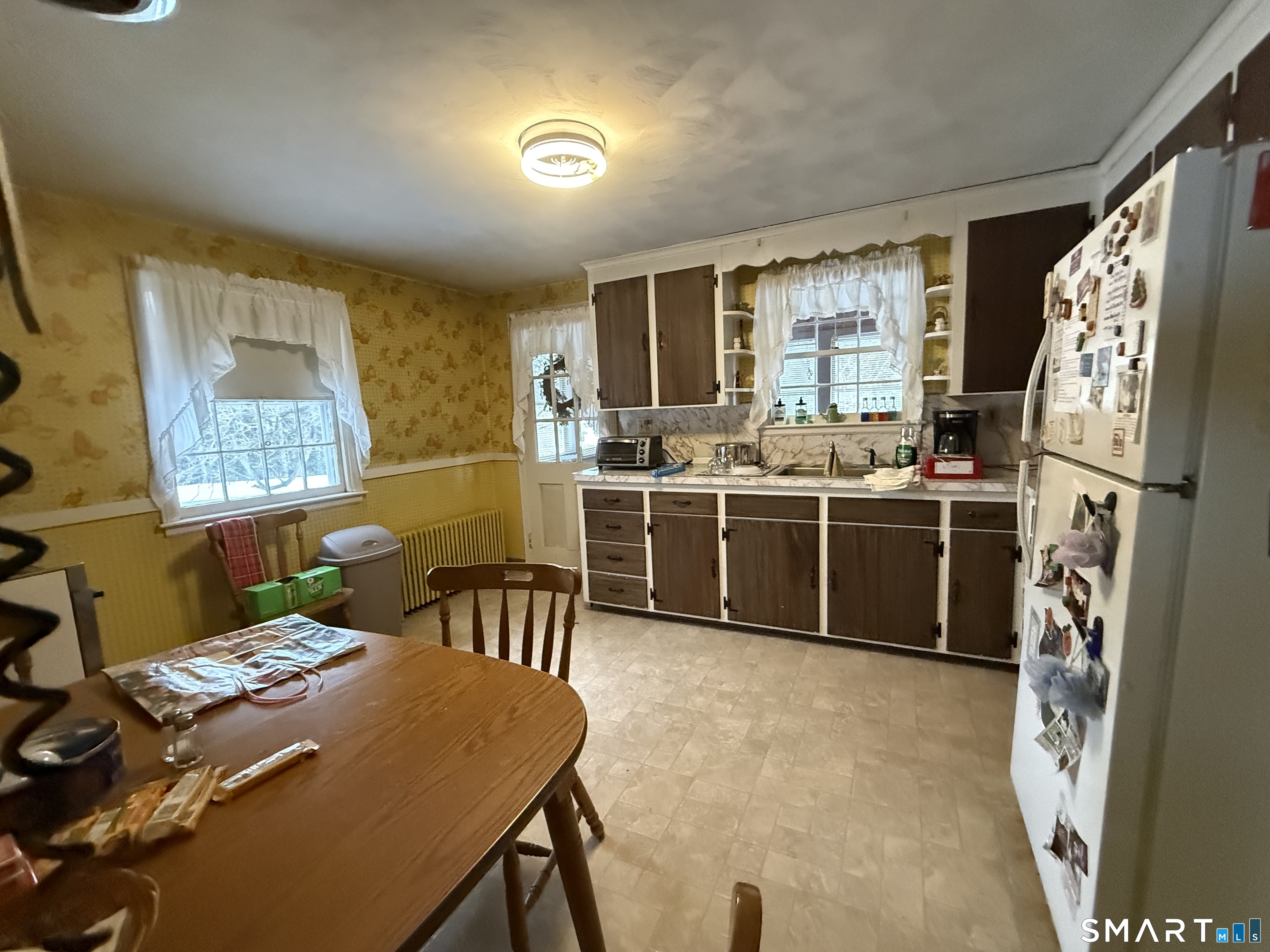 233 Church Street Newington, CT 06111 - Photo 7 of 18 a view of a dining room with furniture window and wooden floor