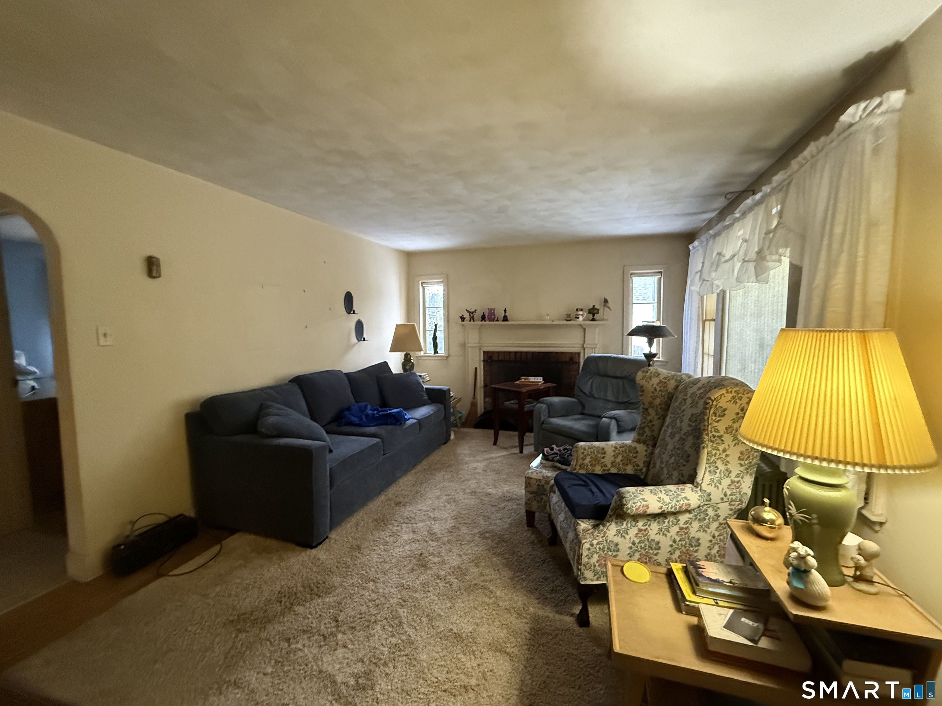 233 Church Street Newington, CT 06111 - Photo 8 of 18 a living room with furniture and a flat screen tv
