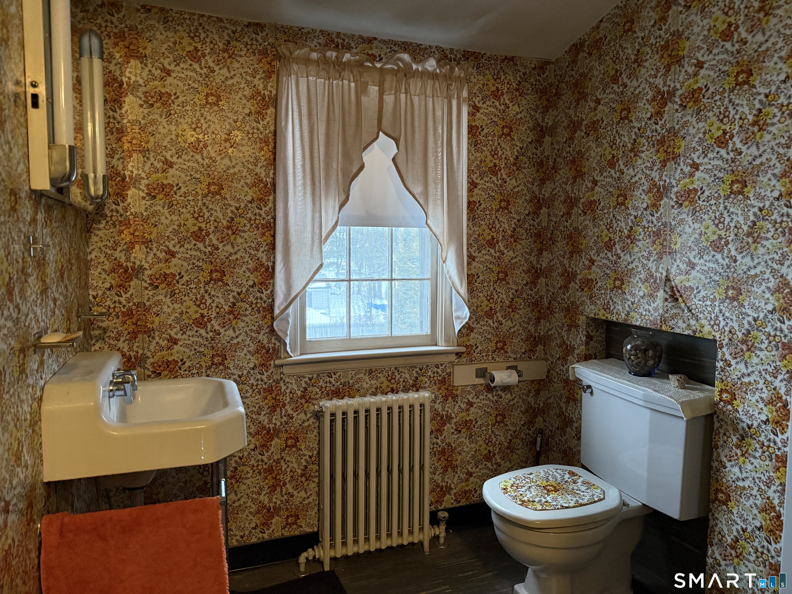 233 Church Street Newington, CT 06111 - Photo 9 of 18 a bathroom with a sink toilet and mirror