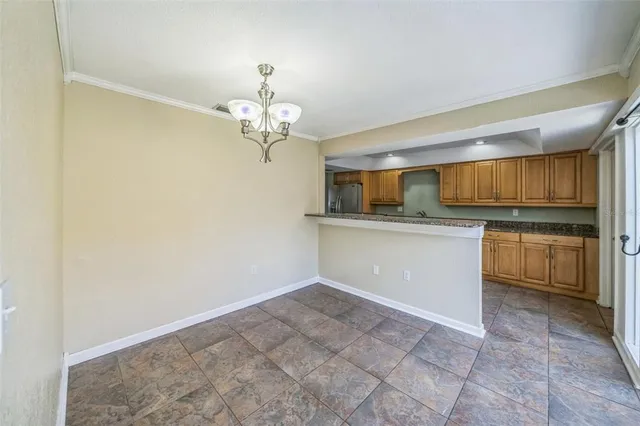 a view of a kitchen with a sink and cabinets