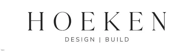 an aerial view of residential house with outdoor space and trees all around