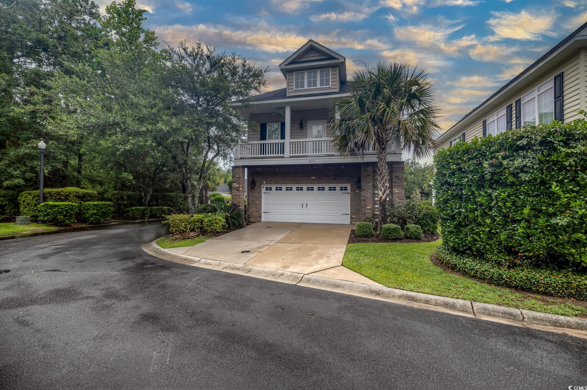 103 Charles Towne Lane Murrells Inlet, SC 29576 - Photo 1 of 23 View of front of property with driveway, brick siding, and an attached garage