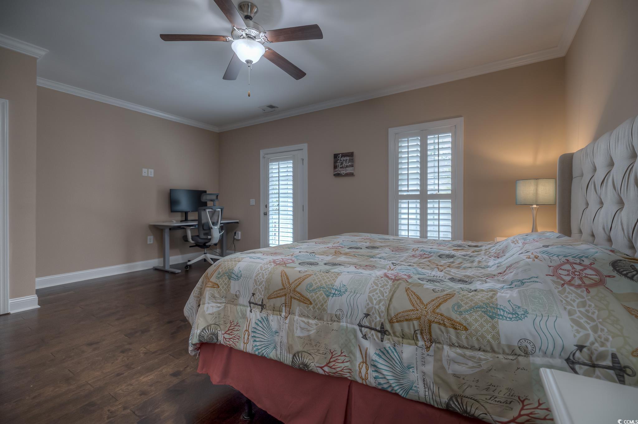103 Charles Towne Lane Murrells Inlet, SC 29576 - Photo 13 of 23 Bedroom with crown molding, dark wood finished floors, a desk, and a ceiling fan