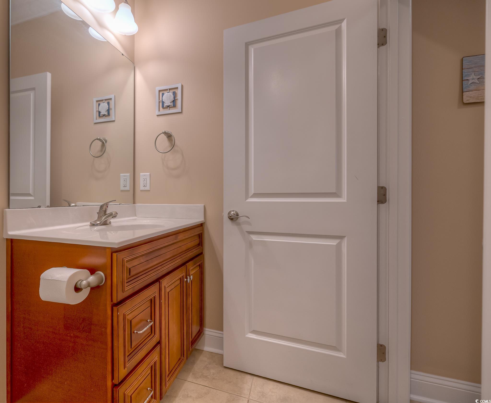 103 Charles Towne Lane Murrells Inlet, SC 29576 - Photo 21 of 23 Bathroom with vanity and tile patterned floors