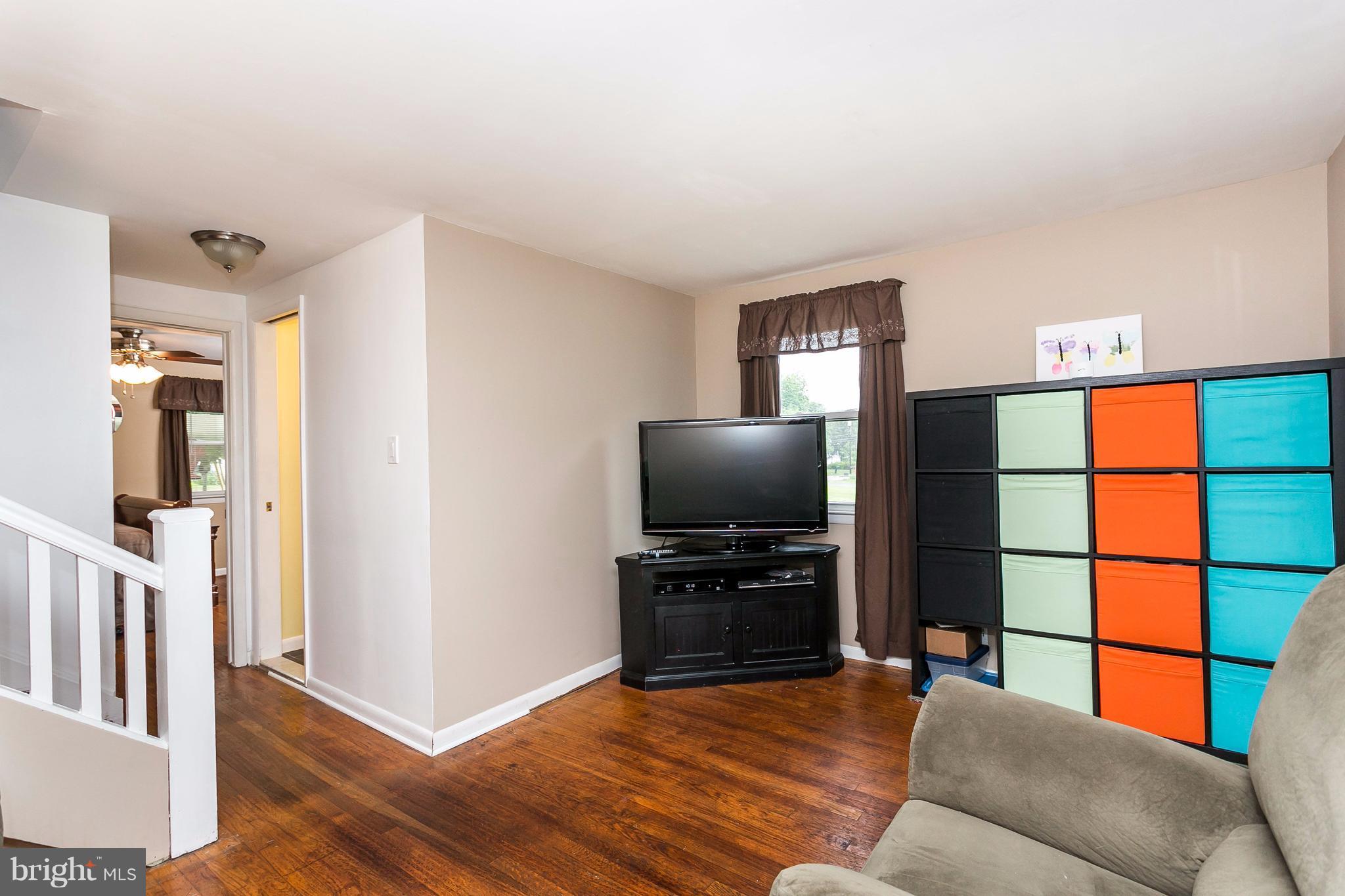 9216 Avondale Road Baltimore, MD 21234 - Photo 21 of 30 Lower level family room with wood floors