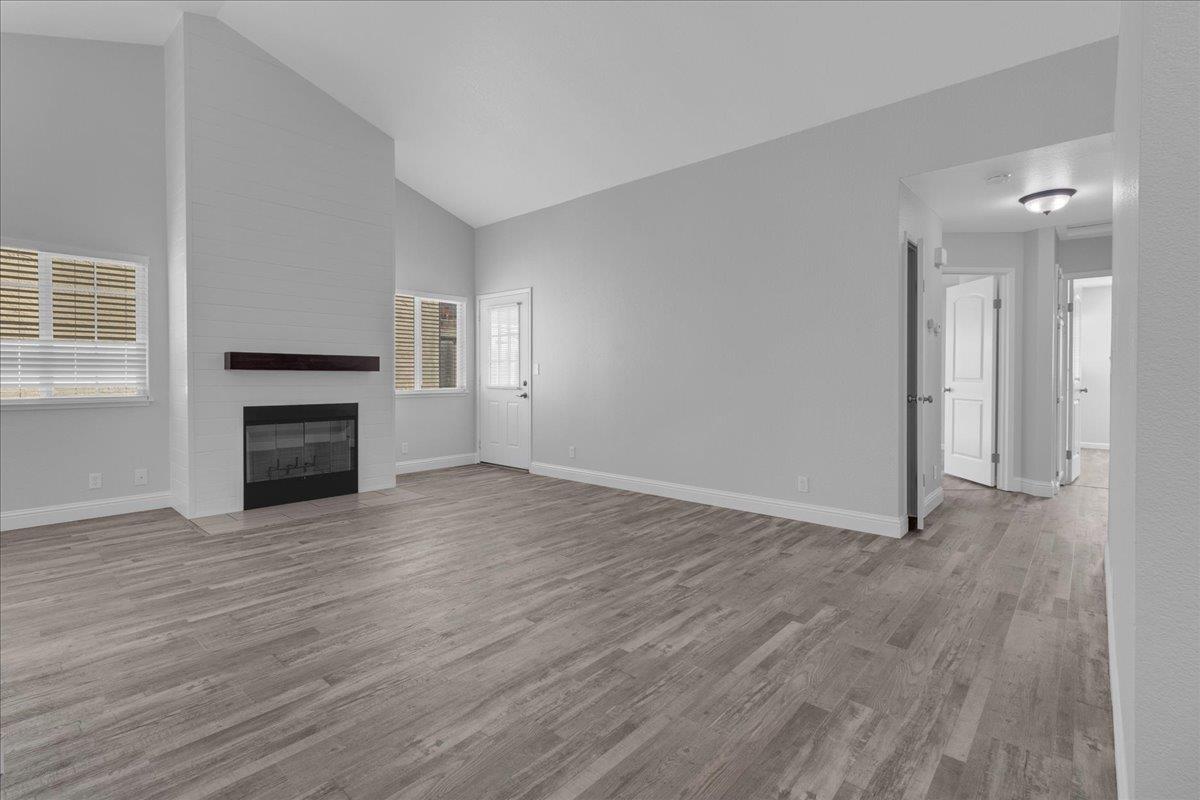 159 Dolphin Circle Marina, CA 93933 - Photo 18 of 31 an empty room with wooden floor fireplace and windows