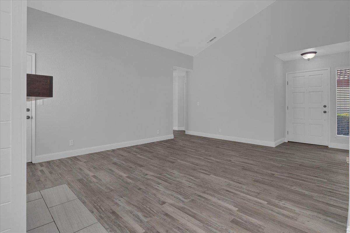 159 Dolphin Circle Marina, CA 93933 - Photo 20 of 31 a view of an empty room with wooden floor and a window