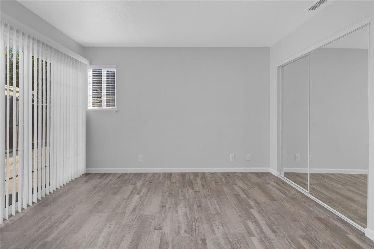 159 Dolphin Circle Marina, CA 93933 - Photo 22 of 31 an empty room with wooden floor and windows