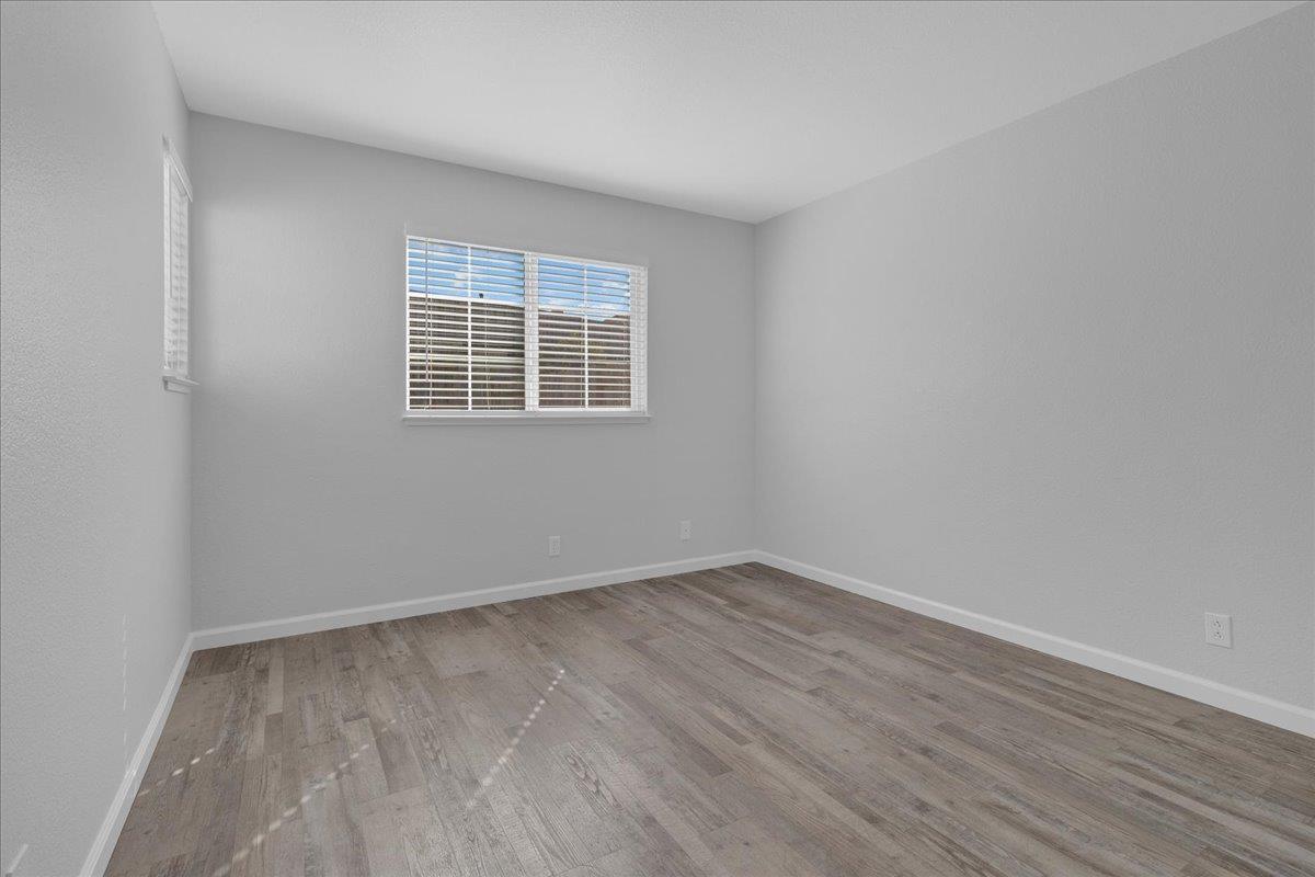 159 Dolphin Circle Marina, CA 93933 - Photo 29 of 31 an empty room with wooden floor and a window